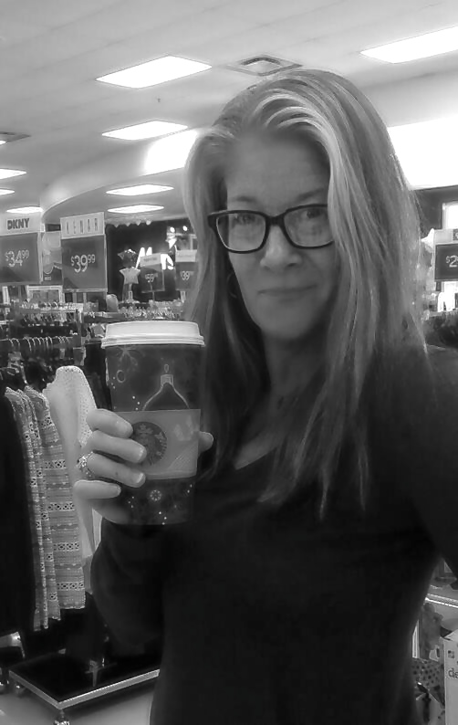 Image is a black and white photo of me wearing glasses and holding a cup of coffee